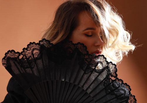 Bita, Spanish Jazz Singer (caucausian woman with yellow hair in black dress with black fan))