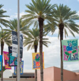 Flags with a message kick off another round of MOCA’s Art on the Plaza