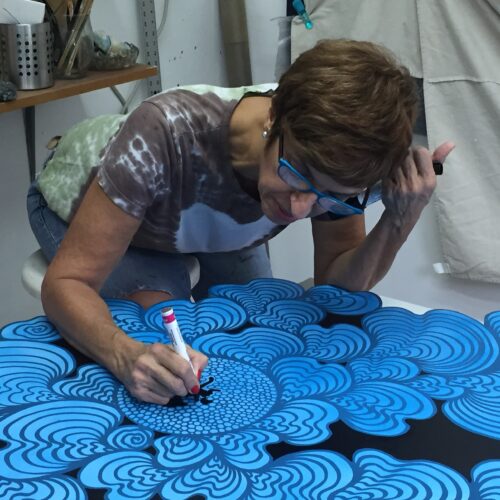Luisa Mesa at work in her studio, where her compositions develop through an intuitive process guided by color and form. (Photo courtesy of the artist)