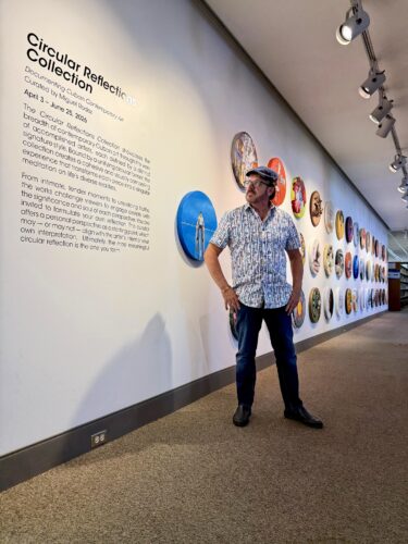Curator Miguel Rodez with works from “Circular Reflections,” a project he developed over nearly a decade to document the breadth of contemporary Cuban art. Photo by Oscar Fuentes. Courtesy of Miguel Rodez.