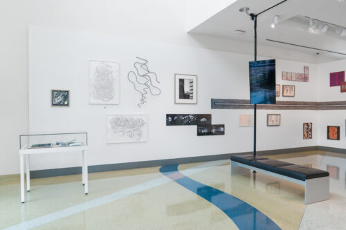 Installation view of “What’s My Line? Drawing as Experience” at the Miami Beach Regional Library, featuring works that expand drawing into sound, digital media, abstraction, and conceptual mapping. (Photo by Mateo SeZa @mateo.seza, courtesy of Edge Zones)